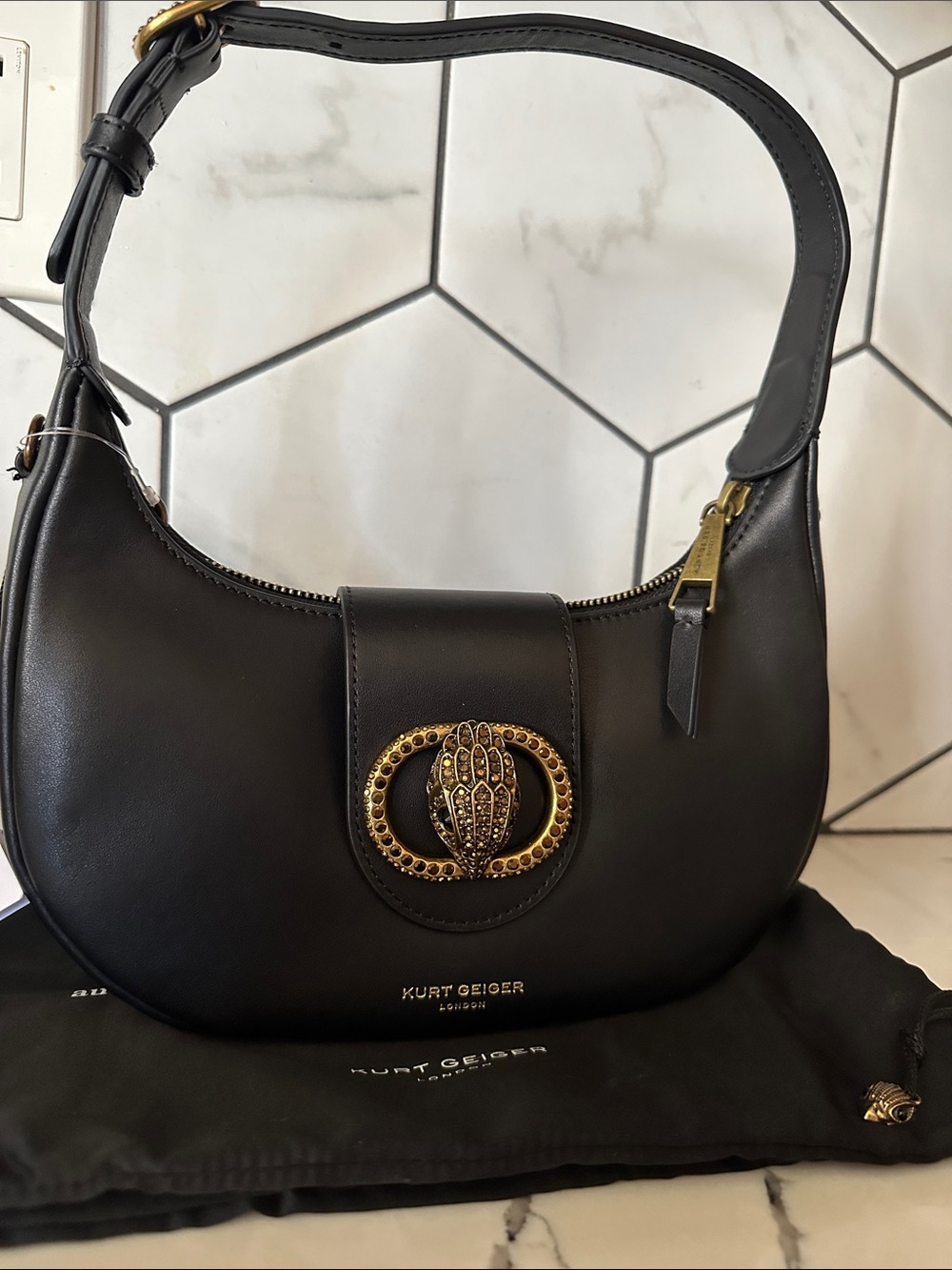 Kurt Geiger Black Leather Crescent Shoulder Bag with Gold Emblem